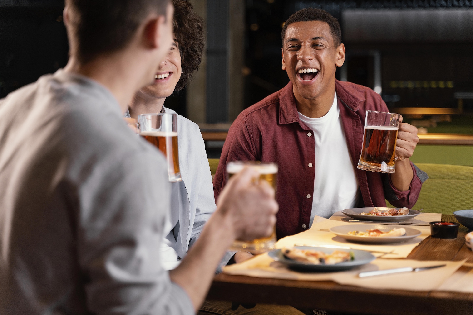 Happy guests with beer mugs