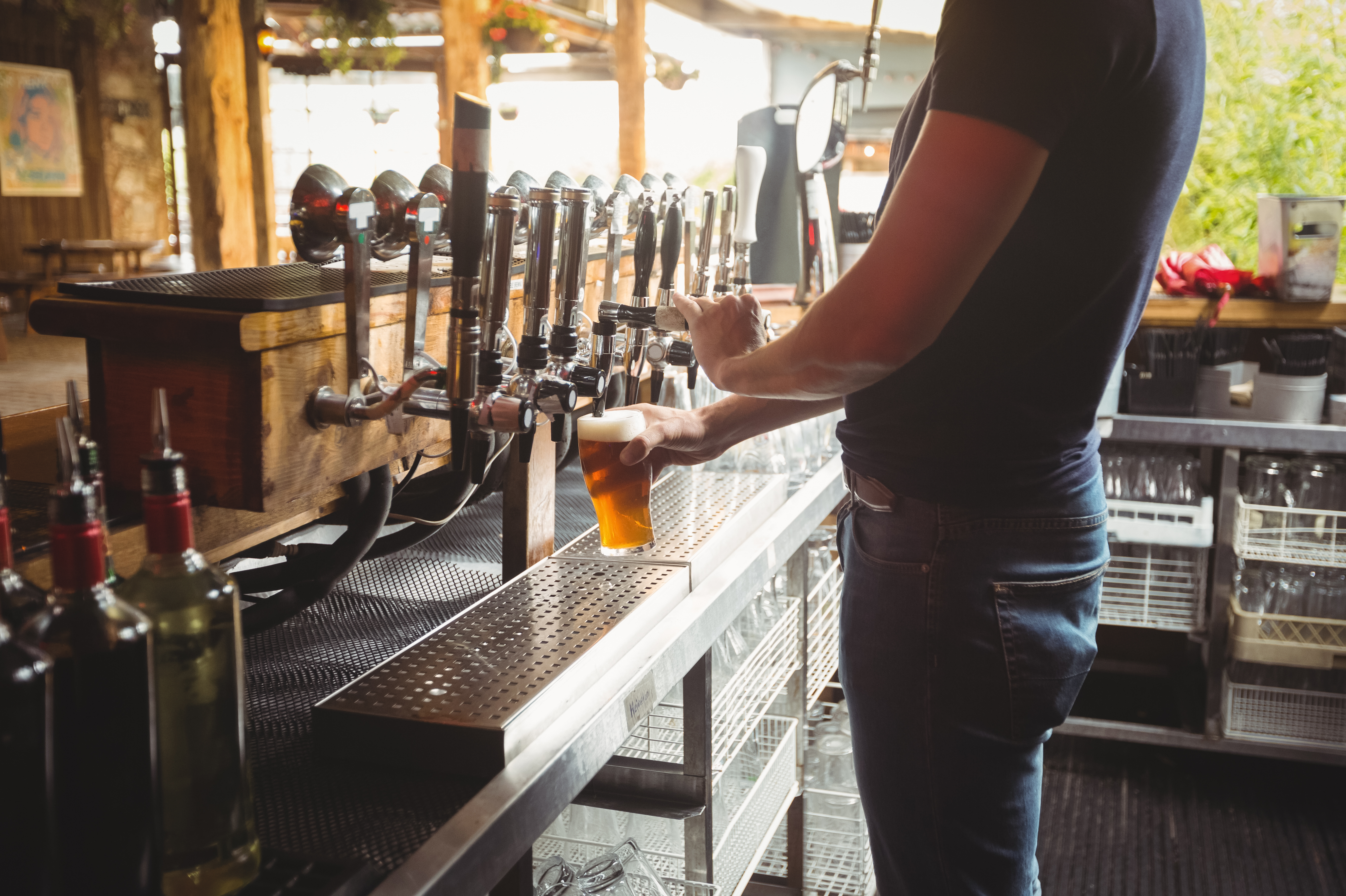 Bartender filling beer